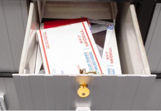 Large PO Box, Size 4, with small and medium-sized packages and other mail.